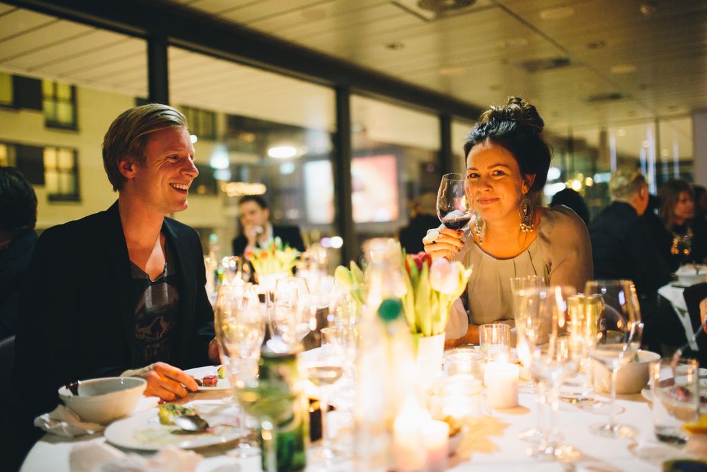 A cheerful dinner gathering in Oslo, capturing warm moments and elegant ambiance.